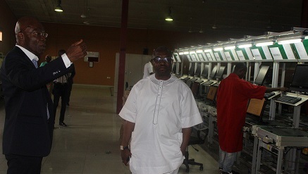 l-r: Leo Stan Ekeh, chairman of Zinox Group, explaining some things to Dr. Vincent Olatunji, acting director general, National Information Technology Development Agency (NITDA), when he paid a visit to Zinox